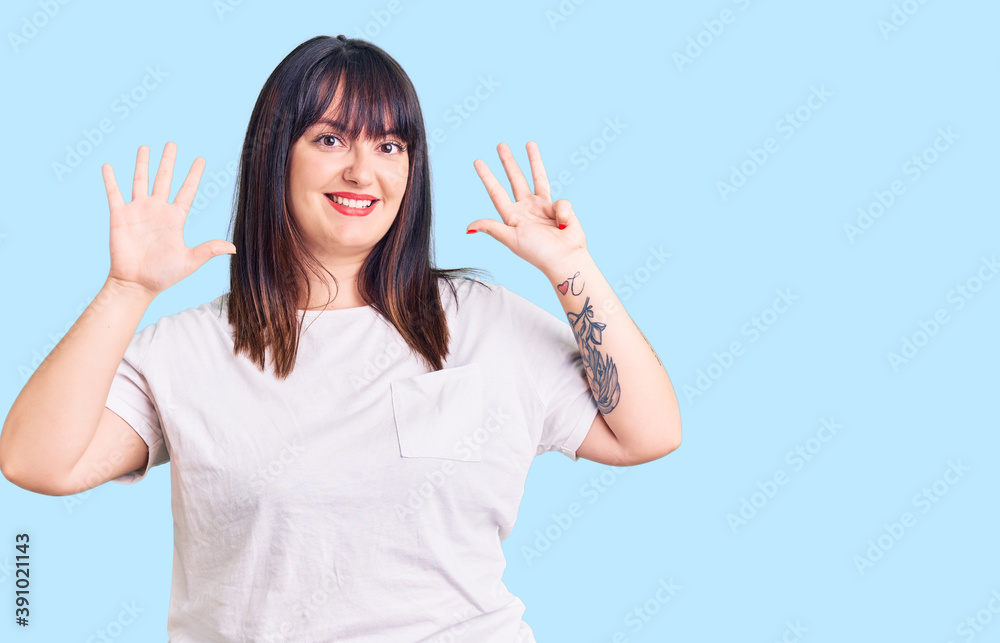 Young plus size woman wearing casual clothes showing and pointing up with fingers number nine while smiling confident and happy. Young plus size woman wearing casual clothes showing and pointing up with fingers number nine while smiling confident and happy.