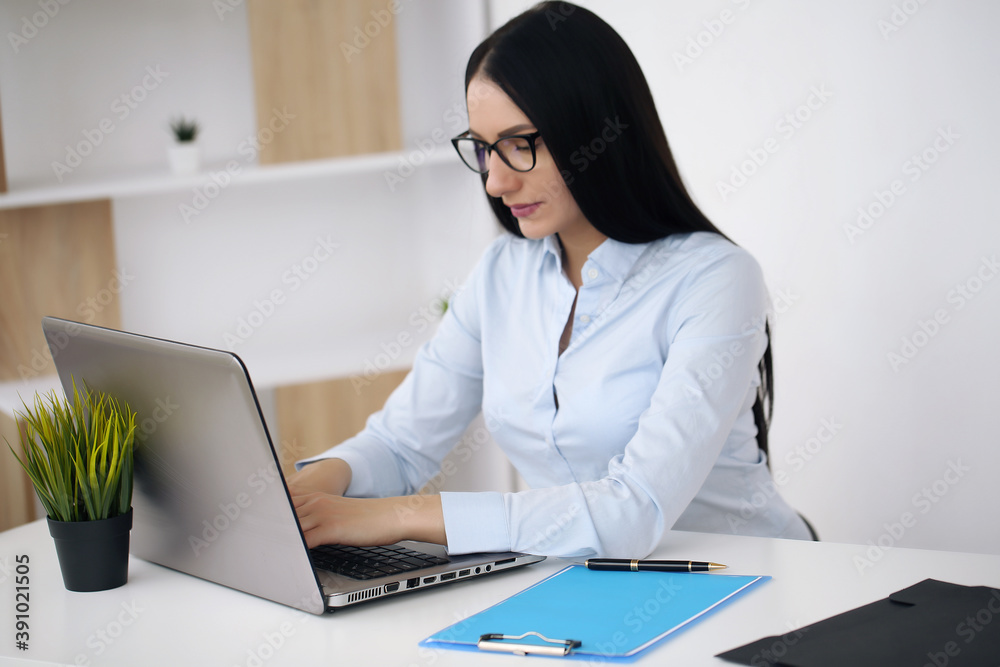 A busy woman makes some important notes A busy woman makes some important notes