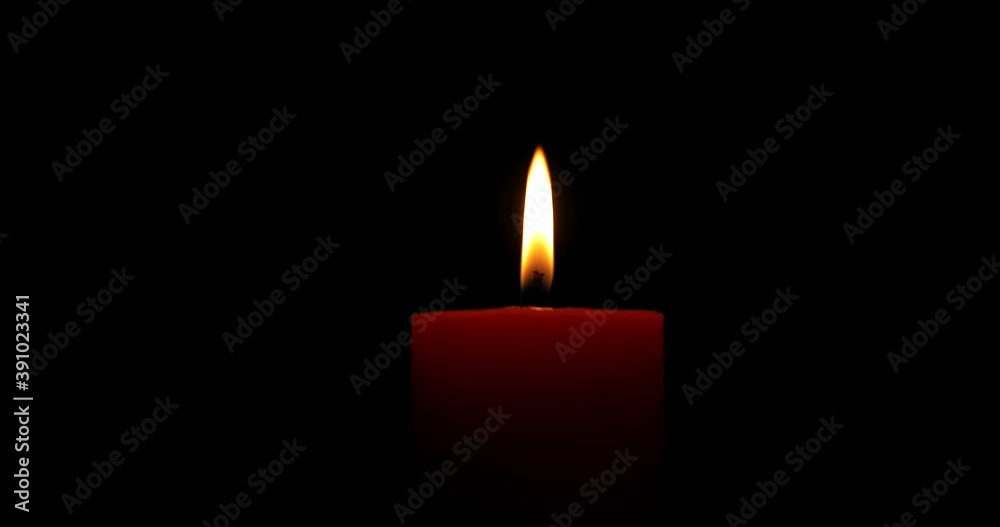 Red candle burning on black background. Red wax candle burning. Close-up. Infinitely flame of candles. Seamlessly loop. Isolated. Macro. 4K Red candle burning on black background. Red wax candle burning. Close-up. Infinitely flame of candles. Seamlessly loop. Isolated. Macro. 4K