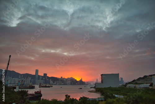 city skyline at sunset, view of Victoria Harbour, from Yau Tong, Kowloon, Hong Kong