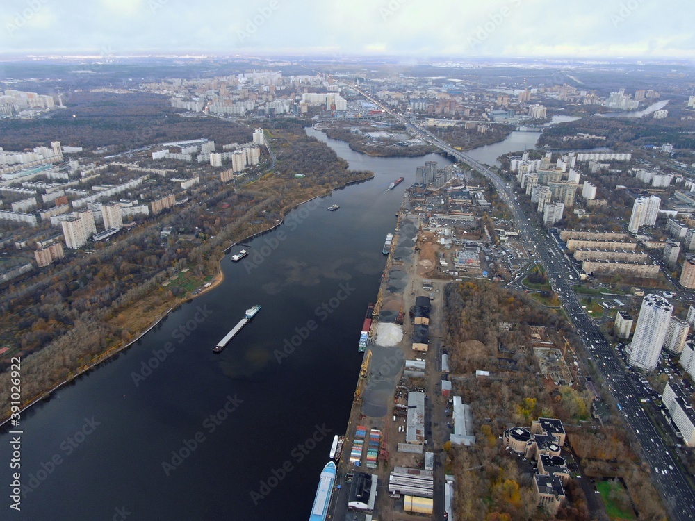 Aerial view panoramic cityscape with great height. River in a big city from a drone