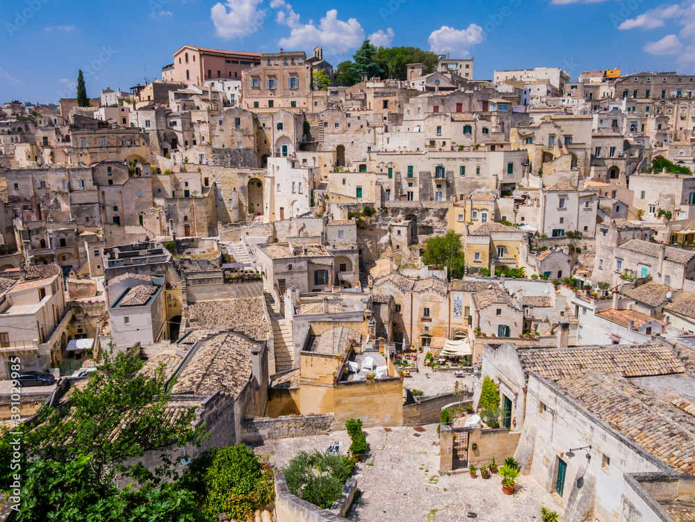 Stunning view of Sasso Barisano district and its characteristic cave dwellings in the ancient town of Matera, Basilicata region, southern Italy
