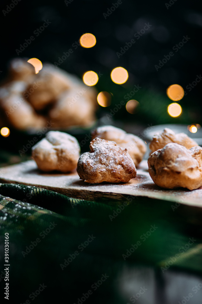 Profiteroles with custard on the table Profiteroles with custard on the table