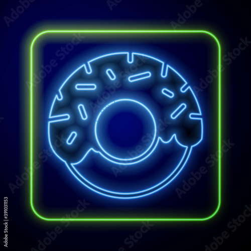 Glowing neon Donut with sweet glaze icon isolated on blue background. Vector.