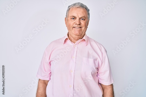 Senior grey-haired man wearing casual clothes with a happy and cool smile on face. lucky person. © Krakenimages.com