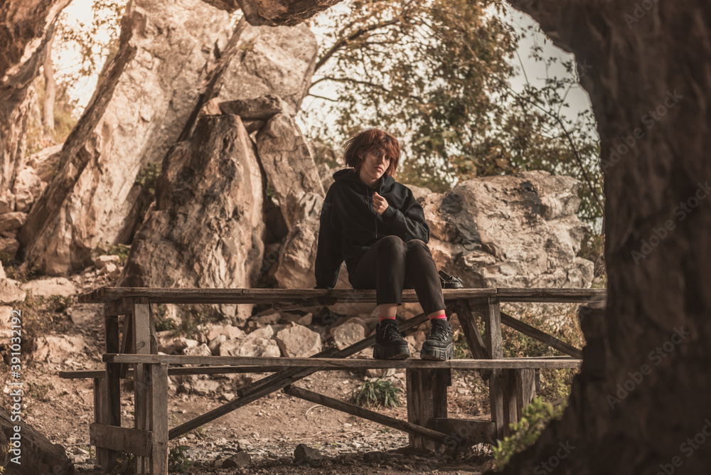 Portrait of a beautiful happy girl with red hair in the cave, lifestyle Portrait of a beautiful happy girl with red hair in the cave, lifestyle