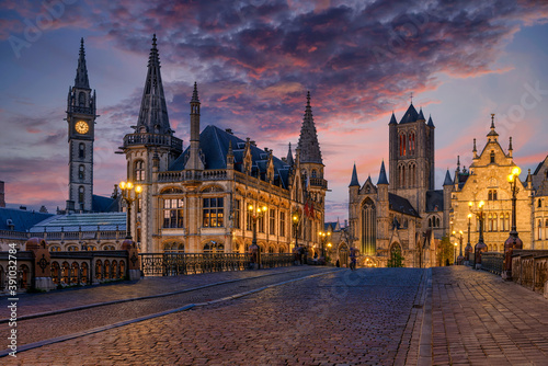 Medieval city of Gent  Ghent  in Flanders with Saint Nicholas Church and Gent Town Hall  Belgium. Sunset cityscape of Gent.