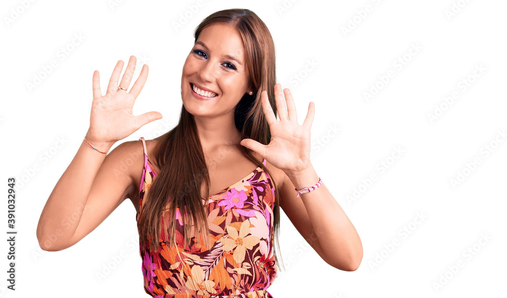 Young beautiful hispanic woman wearing casual clothes showing and pointing up with fingers number ten while smiling confident and happy. Young beautiful hispanic woman wearing casual clothes showing and pointing up with fingers number ten while smiling confident and happy.