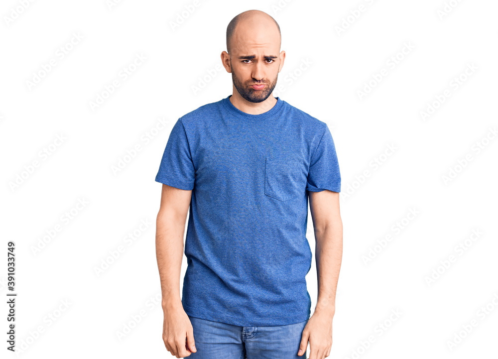 Young handsome man wearing casual t shirt depressed and worry for distress, crying angry and afraid. sad expression. Young handsome man wearing casual t shirt depressed and worry for distress, crying angry and afraid. sad expression.