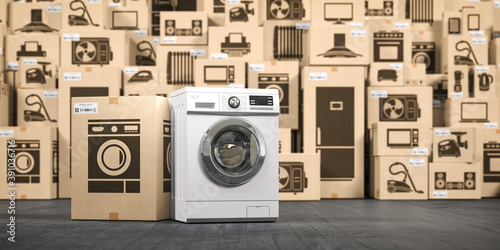 Washing machine in warehouse with household appliances and kitchen electronics in cardboard boxes. Online purchase, shopping and delivery concept.