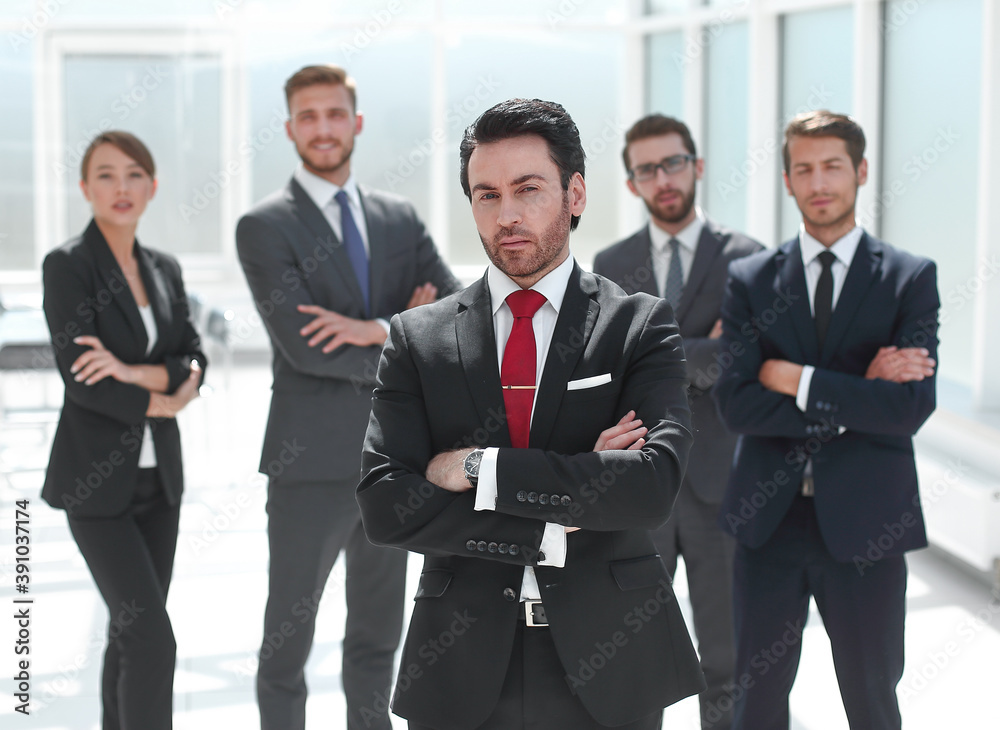 serious businessman standing in the office serious businessman standing in the office