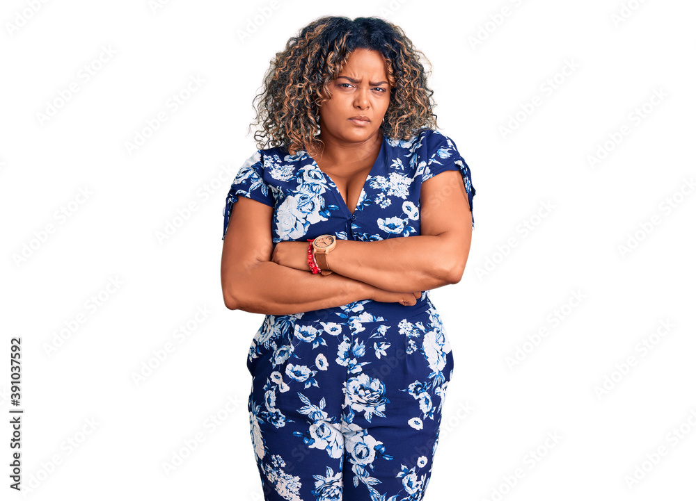 Young african american plus size woman wearing casual clothes skeptic and nervous, disapproving expression on face with crossed arms. negative person. Young african american plus size woman wearing casual clothes skeptic and nervous, disapproving expression on face with crossed arms. negative person.