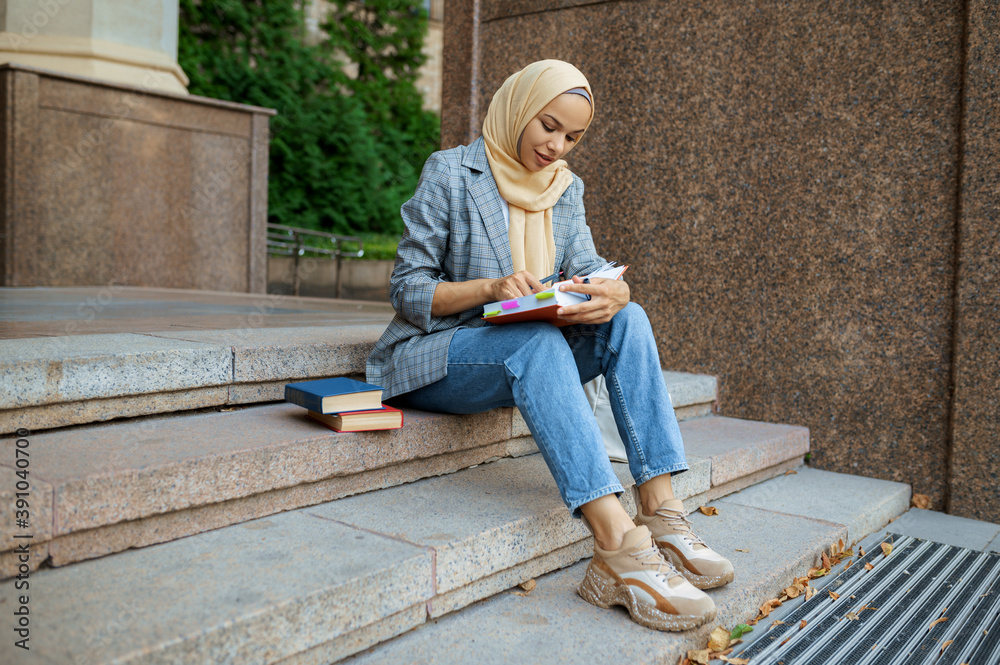 Arab student sitting on the stairs in university Arab student sitting on the stairs in university