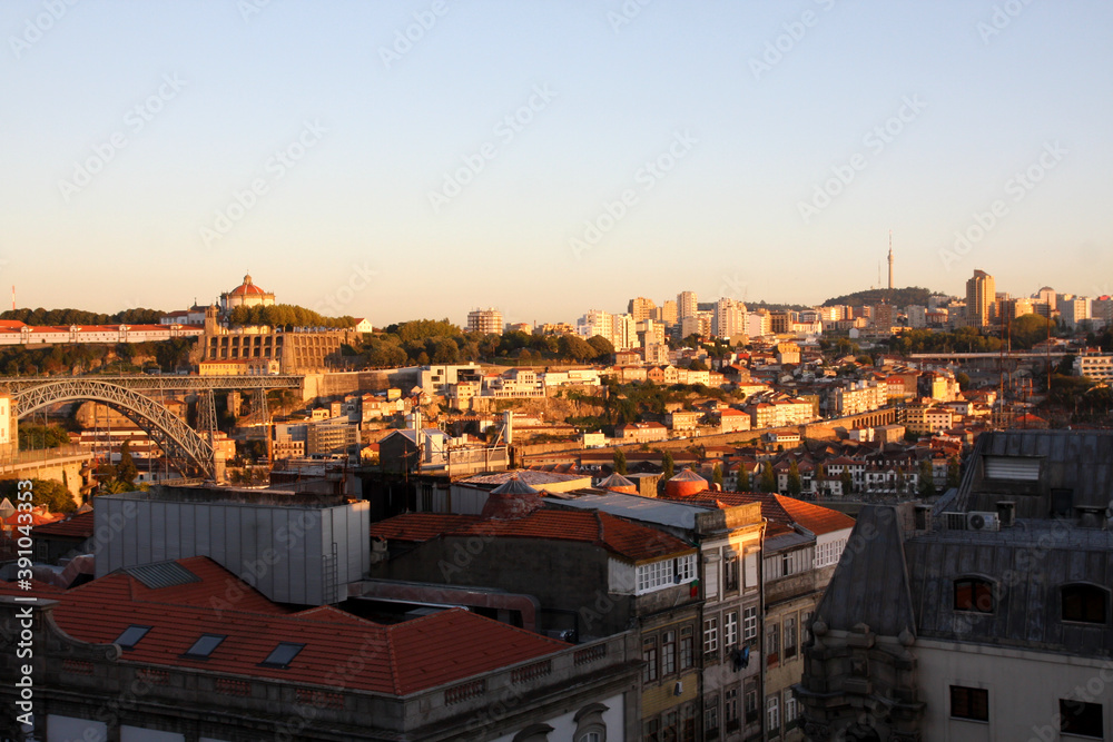 View from the hill on Porto in Portugal. Red roofs of buildings at sunset