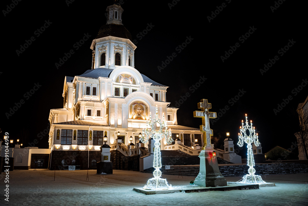 Orthodox Church at night illuminated by lights, old white Church, night architecture
