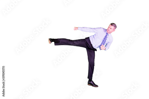 Caucasian businessman kicking copy space on studio