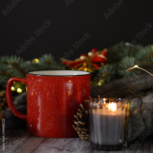 Cacao mug, christmas background with candles and pine cones on christmas tree branch
