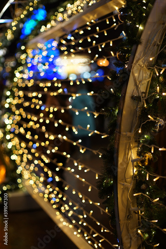 Christmas garland lights in the city. Soft focus background.