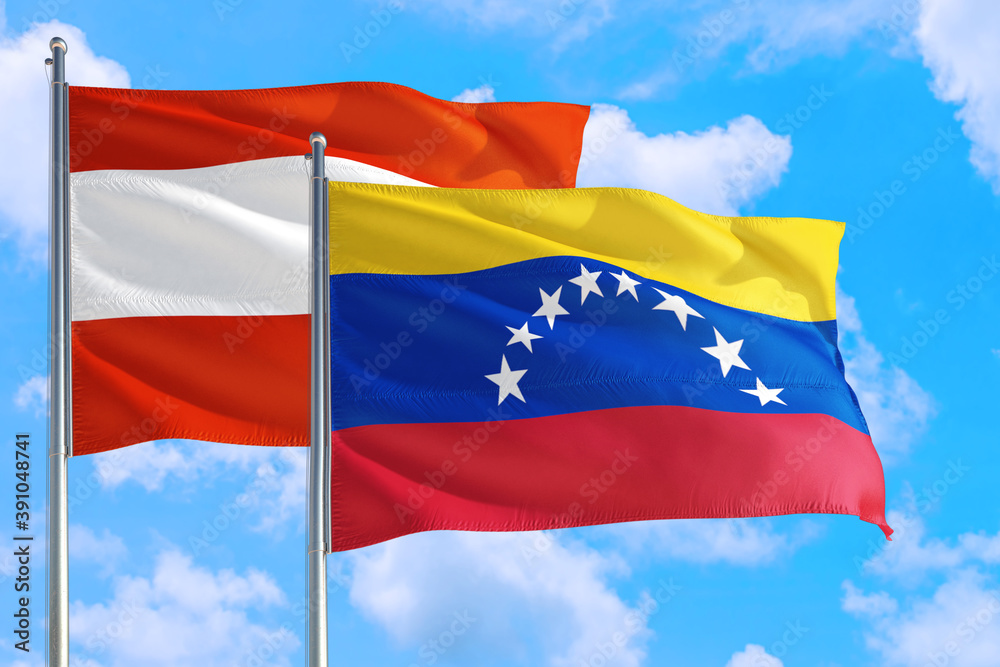 Venezuela and Austria national flag waving in the windy deep blue sky. Diplomacy and international relations concept. Venezuela and Austria national flag waving in the windy deep blue sky. Diplomacy and international relations concept.