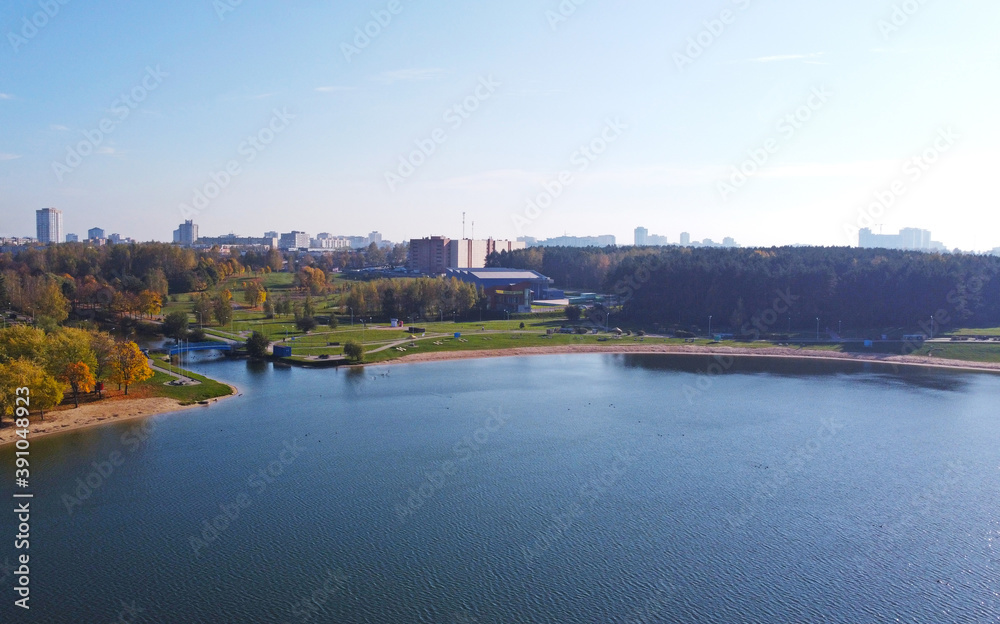 Top view of the city lake near the summer park