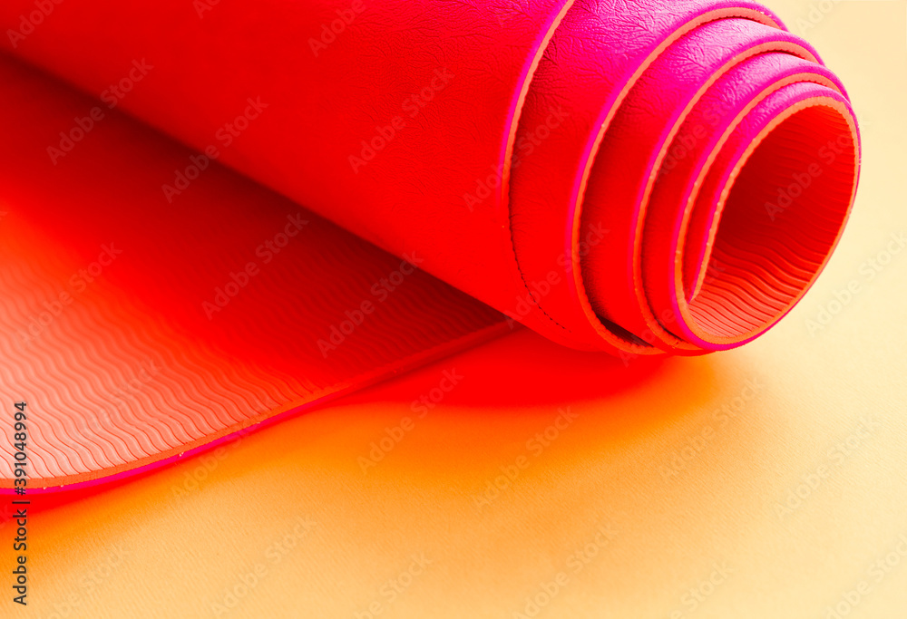 bright pink ultramarine yoga mat on orange background bright pink ultramarine yoga mat on orange background
