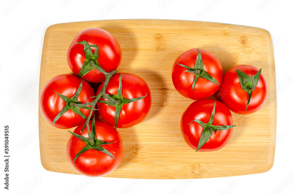 Cherry tomatoes, on a wooden cutting board. close-up Cherry tomatoes, on a wooden cutting board. close-up