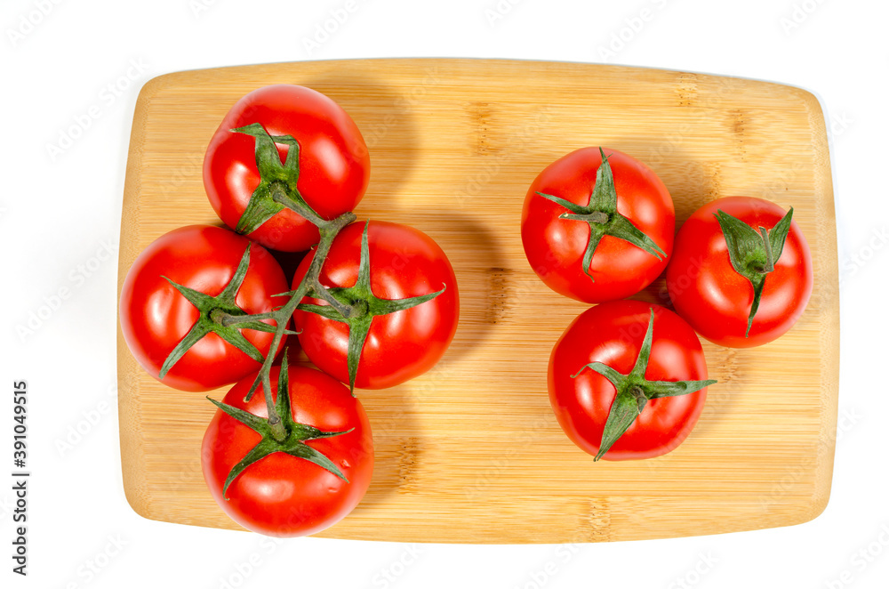 Cherry tomatoes, on a wooden cutting board. close-up