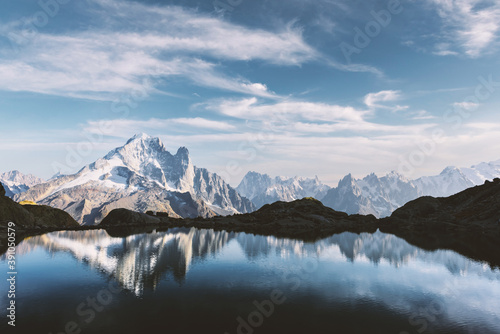 Colourful sunset on Lac Blanc lake in France Alps. Monte Bianco mountain range on background. Vallon de Berard Nature Preserve, Chamonix, Graian Alps