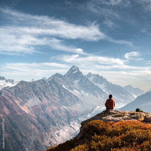 Amazing view on Monte Bianco mountains range with tourist on a foreground. Vallon de Berard Nature Preserve, Chamonix, Graian Alps. Landscape photography