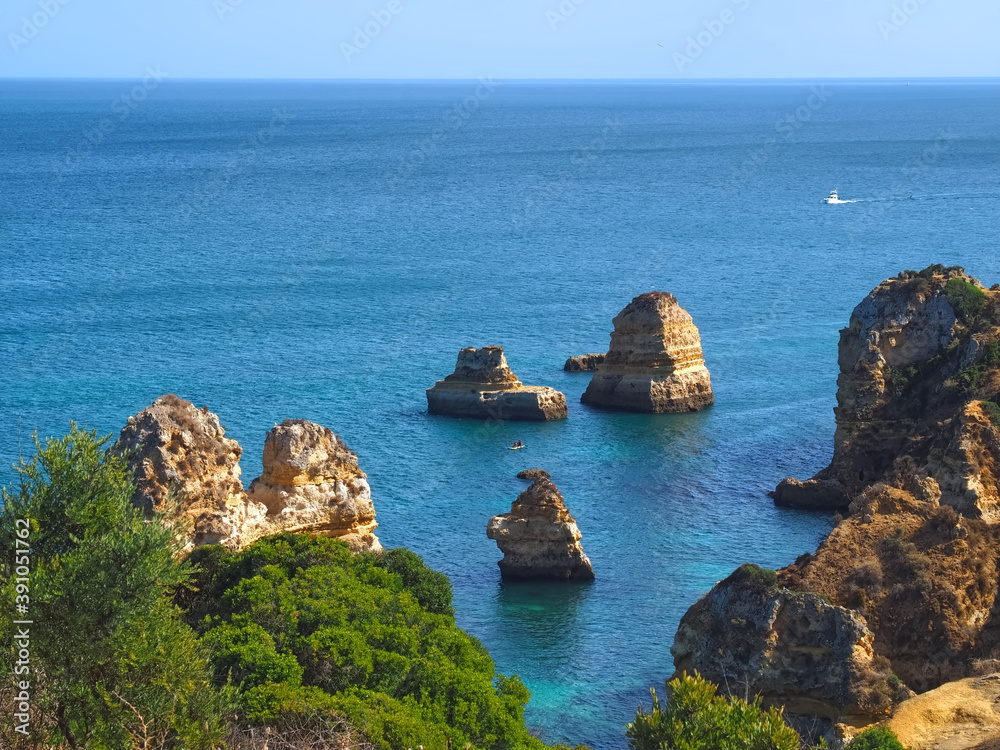 The beauty of Portugal - hiking in Lagos at the blue Atlantic ocean in Portugal