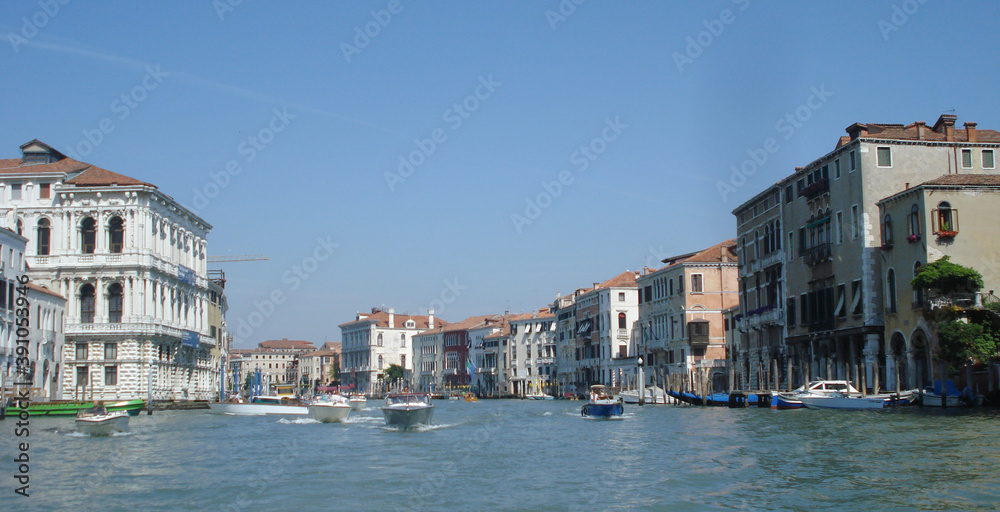 boats on the water among the houses