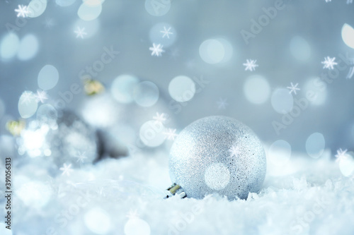 Greeting card design with beautiful Christmas ball and snowflakes, bokeh effect
