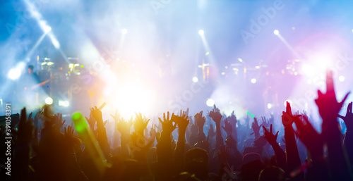 crowd with raised hands at concert festival photo