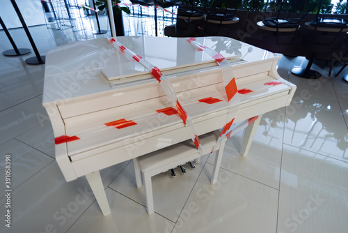 the piano is wrapped with a signal tape, the signal tape on the piano, due to restrictions cannot be touched