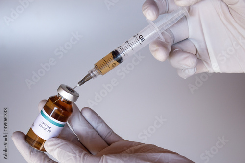 hand holding syringe