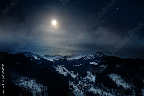 night view of the Polish Tatra Mountains and the moon