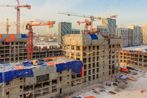 Construction of a monolithic house. Stylobate. Sunny snowy winter day. photo