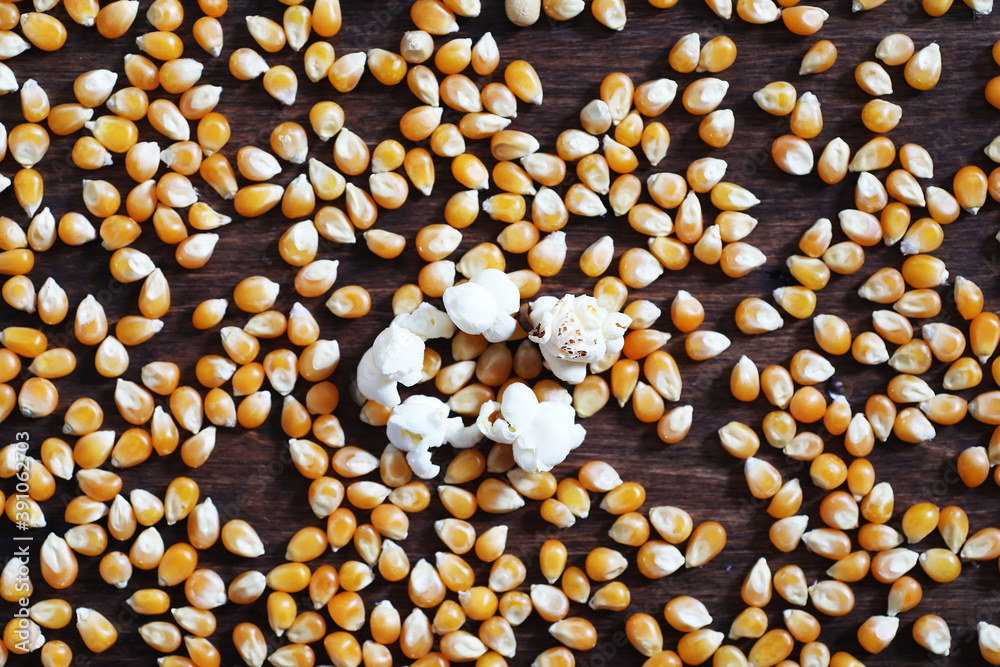 Group of yellow raw corn kernels sweet corn. Grain seeds ingredient lden maize kernel. Wooden table ripe popcorn background. Group of yellow raw corn kernels sweet corn. Grain seeds ingredient lden maize kernel. Wooden table ripe popcorn background.