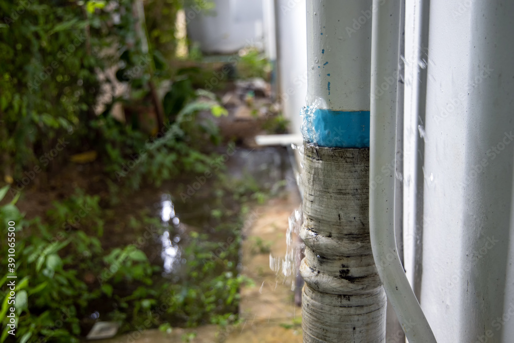 Close-up water bursted leaking from broken pipeline in building. Water splash from drain pipe damage repair and service concept. Close-up water bursted leaking from broken pipeline in building. Water splash from drain pipe damage repair and service concept.