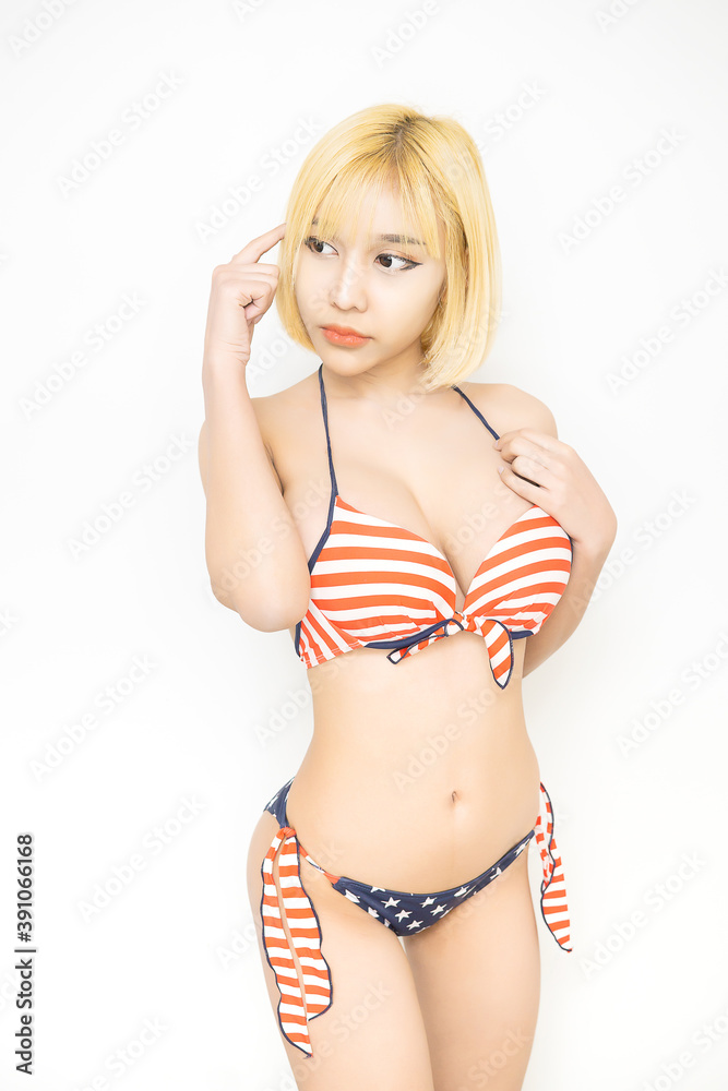 Sexy woman in swimsuit with the USA flag colors,Image of thinking young  lady standing Stock Photo | Adobe Stock