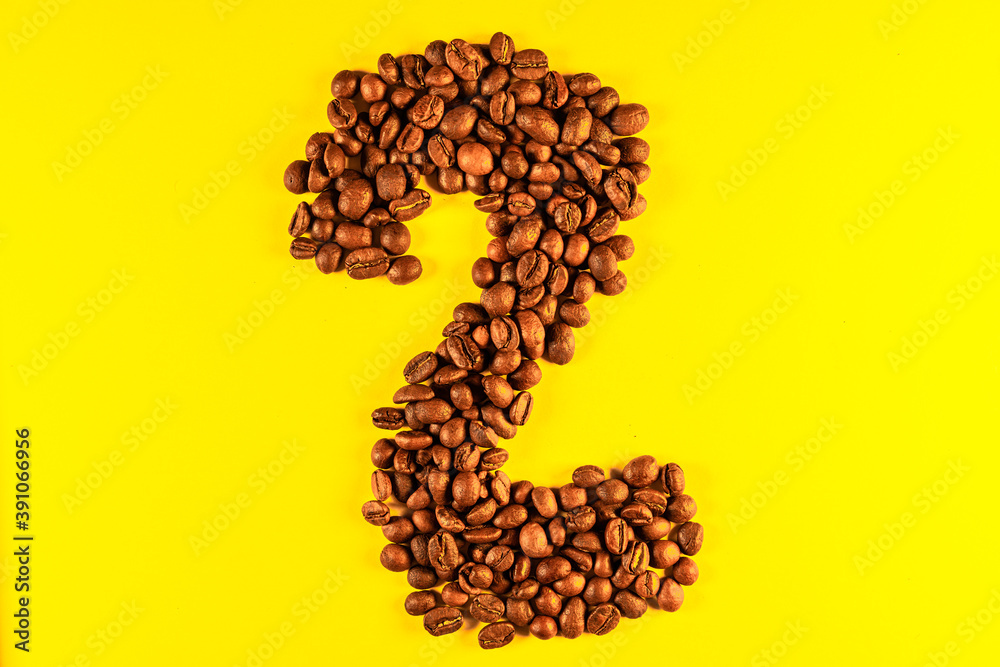 Numbers made with coffee grains on a yellow background. Numbers made with coffee grains on a yellow background.