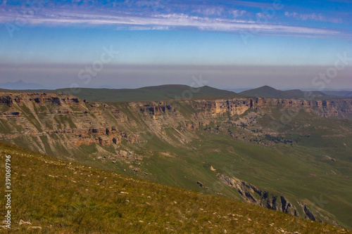 A beautiful gorge in the Caucasus Mountains. Blue sky and huge rocks. Bermamyt plateau