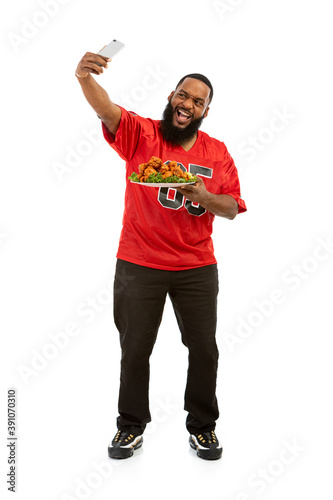 Fan: Sports Man Takes Photo With Platter Of Chicken Wings