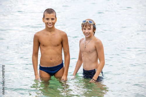 Cheerful boys on the beach