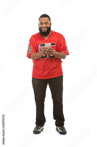 Fan: Man In Sports Jersey Using Cell Phone
