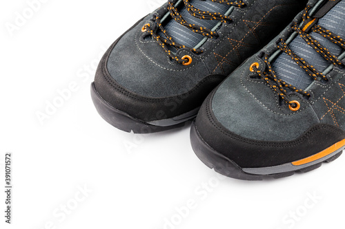 Hiking shoes isolated on white background. Still, artificial light