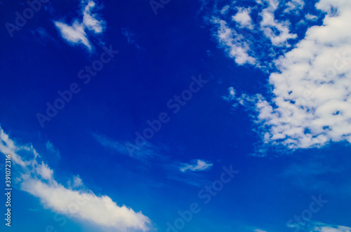 Clear blue sky. bright blue sky background with pure white clouds in the daytime
