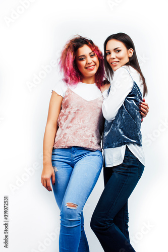 best friends diverse races teenage girls together having fun, asian and african , posing emotional on white background, lifestyle people concept