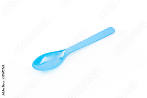 Blue plastic spoon isolated on white background.