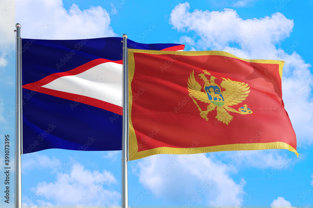 Montenegro and American Samoa national flag waving in the windy deep blue sky. Diplomacy and international relations concept. Montenegro and American Samoa national flag waving in the windy deep blue sky. Diplomacy and international relations concept.